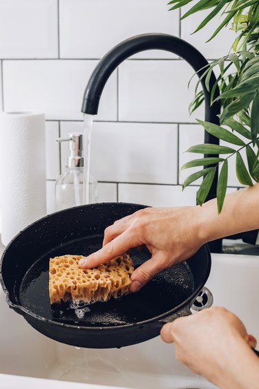 Wash the skillet with soap and water