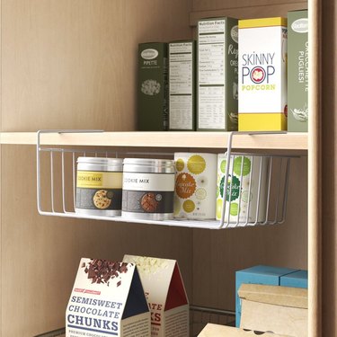 Pantry shelves with under shelf basket.