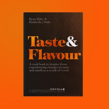taste and flavour cookbook over orange background