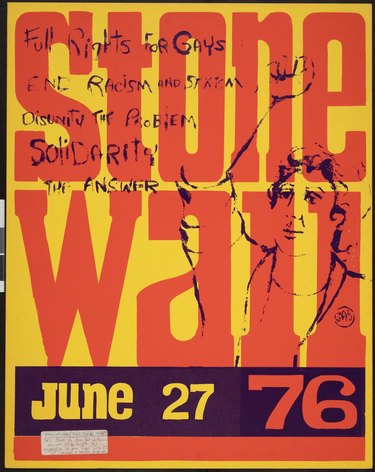 A Stonewall 1976 poster. Text continues: "Full rights for gays; end racism and sexism; disunity the problem; solidarity the answer." Red and purple text on yellow background. The right side of the poster contains a purple drawing of a person with a raised fist. Lower margin contains yellow and orange text on purple background. Lower left corner contains white sticker with handwritten note pertaining to general event details.