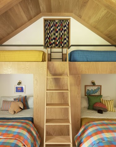 girls' bunk room with a secret cubbyhole at the top of the ladder