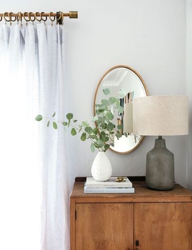 farmhouse bedroom with eucalyptus in vase
