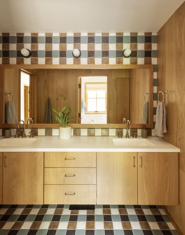 kids' bathroom with gingham patterned tile and wood vanity and wall paneling