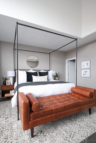 leather cognac bench in gray bedroom