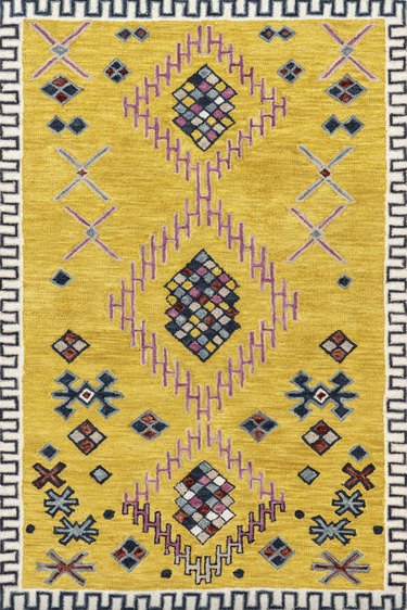 yellow rug with pattern