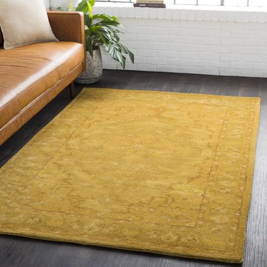 yellow rug with subtle pattern