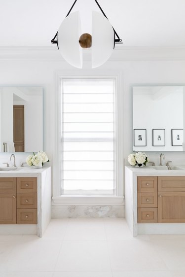 White bathroom with two separate vanities