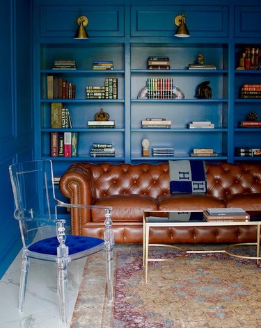 brown leather sofa in blue room