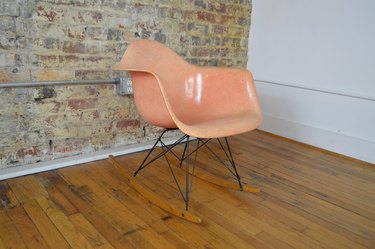 eames light orange rocking chair