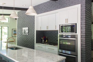 dark gray walls with white cabinets