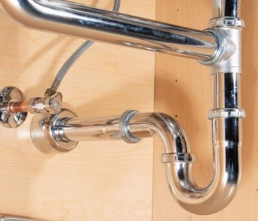 Pipes under sink with tailpiece
