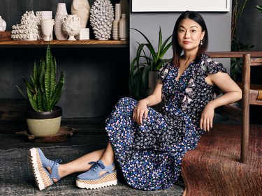 Young Huh, an Asian American designer, in a floral dress