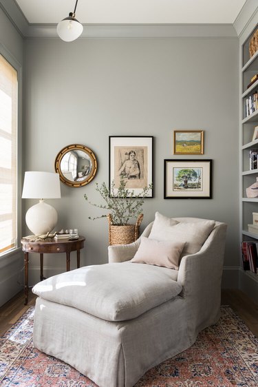 library nook with taupe chaise and gray walls