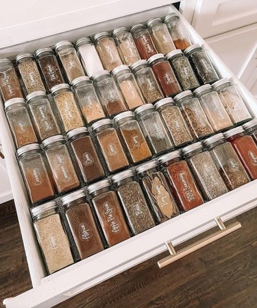 Spices organized inside a drawer.