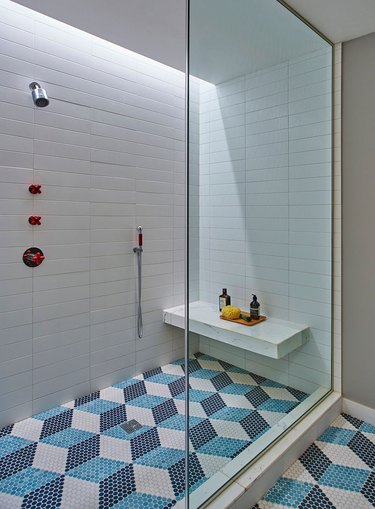modern kids bathroom with geometric penny tile mosaic 3D cube/hexagon patterned floor in blues and whites