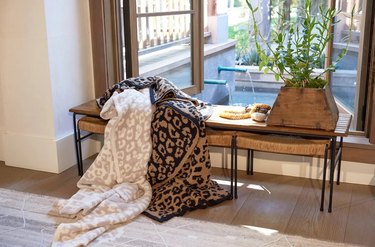 leopard blankets on bench