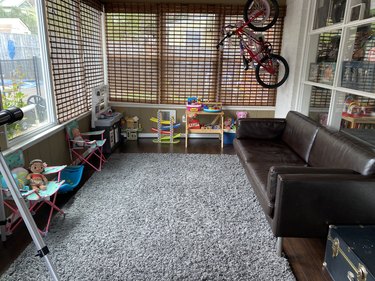 playroom with couch and hanging bike