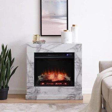 A marble electric fireplace in a modern living room