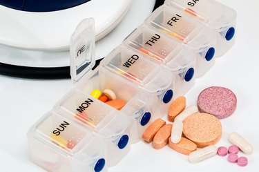 pills and vitamins in pill box