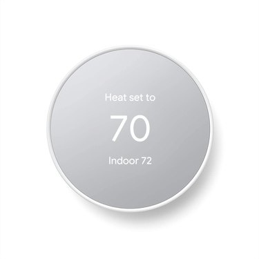 A Google Nest thermostat, which is a smart thermostat