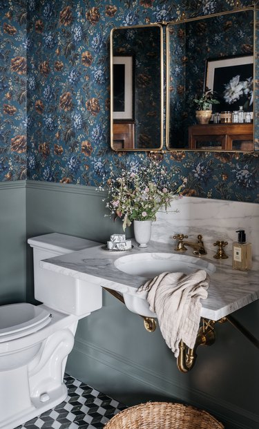 blue-green bathroom with floral wallpaper