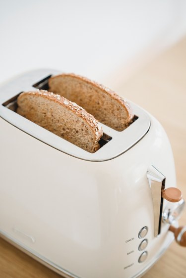 Slices of bread in a white toaster