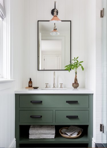 farmhouse-inspired bathroom with green vanity