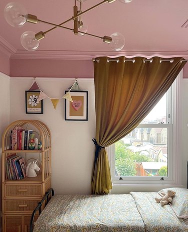 little girls bedroom with pink and white walls