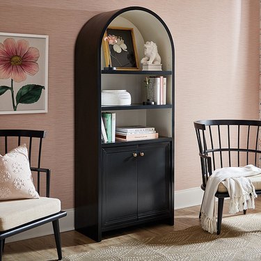 black arched bookcase with storage