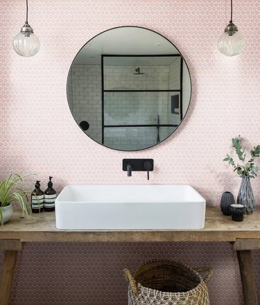 pink penny tile bathroom backsplash with rustic vanity and vessel sink