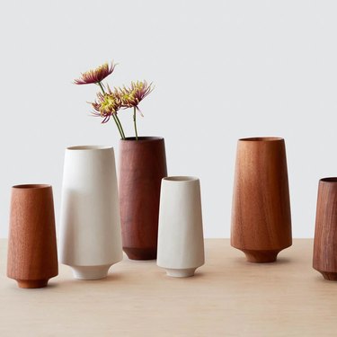 wood cylindrical vases in beige and brown