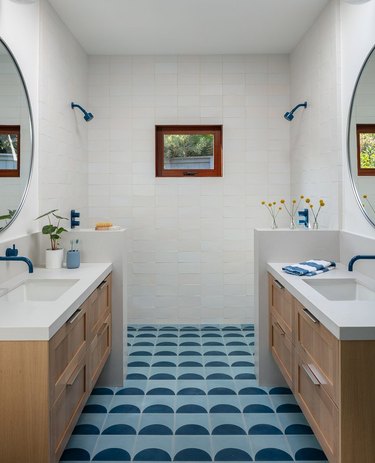 contemporary and midcentury bathroom with half-circle motif blue tiles and coordinating blue faucets and fixtures