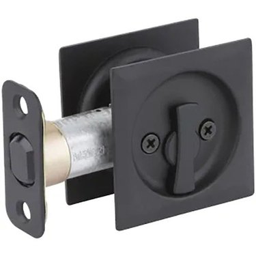 A black pocket door lock