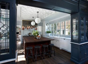 kitchen with cherry wood island and navy blue walls