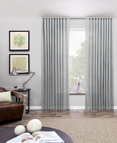 room with monochrome pale gray walls and curtains