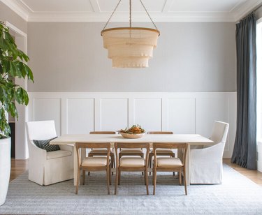 greige and white dining room with chair rail