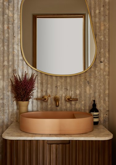 powder room with flute tile and oval sink