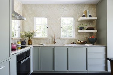 light green and tan kitchen color idea with black appliance