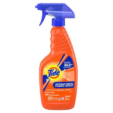 A bottle of Tide antibacterial fabric spray