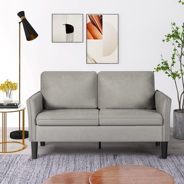 gray sofa with dark legs