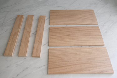 Six wood pieces cut out for spice drawer organizer