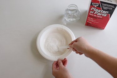 Stirring water into plaster