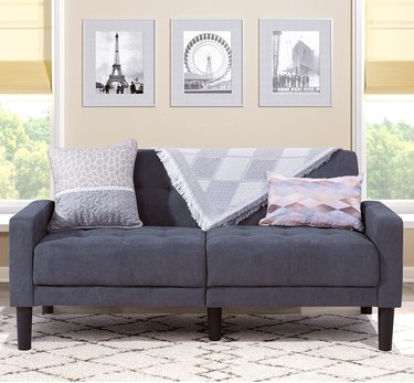 gray sofa with blanket