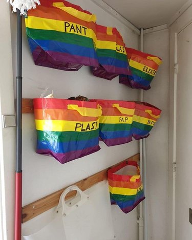 rainbow ikea bags hanging on a wall
