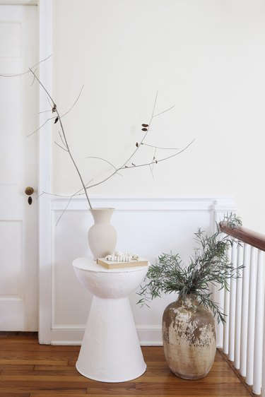 DIY plaster side table styled with vase and branches