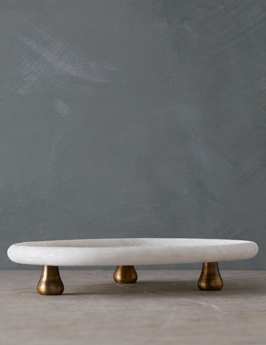 Small white marble tray with small gold legs