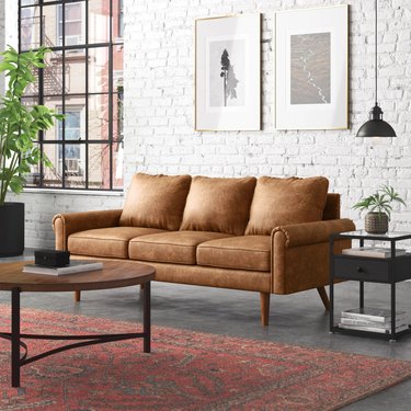 brown faux leather distressed sofa with rolled arms