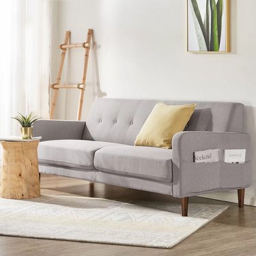 couch with magazine holders