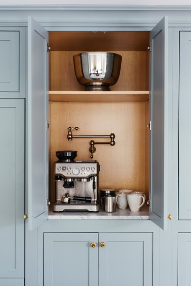 modern appliance garage with pot filler and stainless steel espresso machine