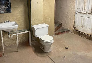 Open toilet in a basement